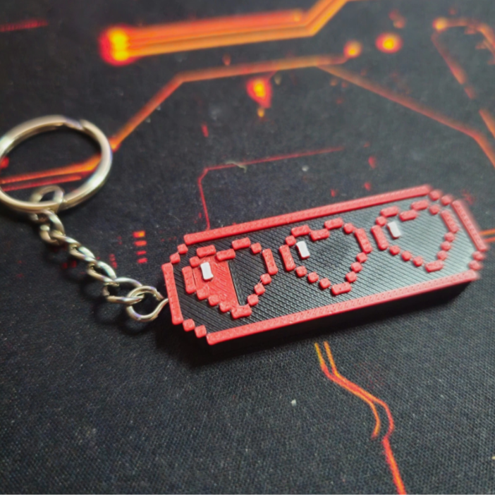 Pixelated HP Bar keychain on a dark surface with red accents